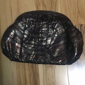 Lodi’s “Suzette” metallic print large clutch